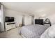 Comfortable main bedroom with neutral colors, modern furnishings, and ample natural light at 9350 Dunraven St, Arvada, CO 80007