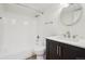 Updated bathroom with new fixtures, vanity, and a shower-tub combination at 3100 S Federal Blvd # 232, Denver, CO 80236