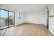 Spacious living room with access to a balcony providing natural light at 3100 S Federal Blvd # 232, Denver, CO 80236