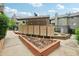 A common area featuring a bank of mailboxes with landscaping and a sidewalk at 3100 S Federal Blvd # 232, Denver, CO 80236