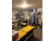 Unfinished basement featuring storage shelves and hanging clothes rack at 19645 E Buchanan Pl, Aurora, CO 80011