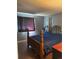 Comfortable bedroom with hardwood floors, a cozy bed, and a serene atmosphere at 19645 E Buchanan Pl, Aurora, CO 80011