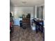 Inviting dining area featuring a built-in cabinet, ample seating, and neutral color scheme at 19645 E Buchanan Pl, Aurora, CO 80011