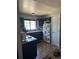 Efficient kitchen with dark cabinetry, a window over the sink, and ample counter space at 19645 E Buchanan Pl, Aurora, CO 80011