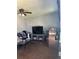 Cozy living room with hardwood floors, ceiling fan, and a comfortable seating area at 19645 E Buchanan Pl, Aurora, CO 80011
