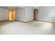 Large finished basement with carpeting and access to additional rooms at 2040 Yarrow St, Lakewood, CO 80214