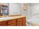Well-lit bathroom featuring a vanity with storage and a shower-tub combination at 2040 Yarrow St, Lakewood, CO 80214