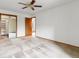 Spacious bedroom features an open closet with shelves, carpeted floor, and ample natural light at 2040 Yarrow St, Lakewood, CO 80214