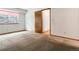 Bright bedroom featuring plush carpeting, large windows, and neutral walls at 2040 Yarrow St, Lakewood, CO 80214