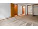 Bedroom showcasing neutral carpet flooring with multiple entryways and a large closet with sliding doors at 2040 Yarrow St, Lakewood, CO 80214