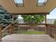 Back deck with trees and a backyard view at 2040 Yarrow St, Lakewood, CO 80214