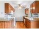 Traditional kitchen featuring wood cabinets, granite countertops, and decorative backsplash at 2040 Yarrow St, Lakewood, CO 80214