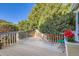 Relaxing back deck with a peaceful wooded view and plenty of seating at 5191 S Nepal Way, Centennial, CO 80015
