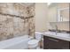 The updated bathroom features modern fixtures, neutral tile, and a shower and tub combination at 5191 S Nepal Way, Centennial, CO 80015