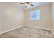 Neutral carpeted bedroom with neutral walls, a window, and a ceiling fan at 5191 S Nepal Way, Centennial, CO 80015
