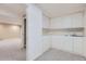 Bright bonus room features a sink, plenty of cabinets, and adjacent carpeted room at 5191 S Nepal Way, Centennial, CO 80015