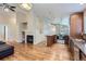 Open-concept living area with fireplace and seamless flow to the kitchen at 5191 S Nepal Way, Centennial, CO 80015
