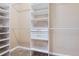 A walk-in closet featuring built-in shelving and drawers to maximize storage and organization at 5191 S Nepal Way, Centennial, CO 80015