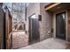 Private backyard area with a wooden gate and brick exterior, offering a secluded outdoor space at 1632 N Gilpin St, Denver, CO 80218