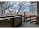 Open-air balcony with wooden accents and charming pendant lights, perfect for outdoor relaxation at 1632 N Gilpin St, Denver, CO 80218