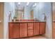 Bathroom featuring a double vanity, tile floors, and a walk-in shower, offering a bright and spacious design at 1632 N Gilpin St, Denver, CO 80218