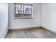 Simple bedroom featuring a large window offering plenty of natural light at 1632 N Gilpin St, Denver, CO 80218