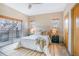 Bright bedroom with balcony access, neutral decor, and comfortable furnishings at 1632 N Gilpin St, Denver, CO 80218