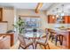 Cozy dining area with an open view into the kitchen, featuring hardwood floors and modern lighting at 1632 N Gilpin St, Denver, CO 80218