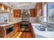 Modern kitchen with stainless steel appliances, custom cabinets, quartz countertops, and ample natural light at 1632 N Gilpin St, Denver, CO 80218