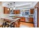 Modern kitchen featuring stainless steel appliances, a center island, and ample cabinet space at 1632 N Gilpin St, Denver, CO 80218