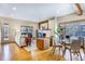 Bright living room with hardwood floors, a fireplace, and a dining area with large windows at 1632 N Gilpin St, Denver, CO 80218