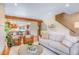 Comfortable living room featuring hardwood floors, an open floor plan, and a view into the kitchen at 1632 N Gilpin St, Denver, CO 80218