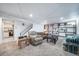 Finished basement with plush carpeting, staircase, built-in shelving, and recreational space at 6625 S Ogden St, Centennial, CO 80121