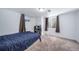 Cozy bedroom featuring a bed, window, closet, and neutral carpet, perfect for a restful retreat at 6625 S Ogden St, Centennial, CO 80121
