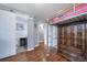 bedroom with bunk beds, a barn door and hardwood floors at 6625 S Ogden St, Centennial, CO 80121