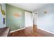 Bedroom showcasing hardwood floors, closet space, and neutral walls for versatile decor at 6625 S Ogden St, Centennial, CO 80121