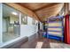 Unique bonus room with climbing wall, wood ceiling, and open floor plan at 6625 S Ogden St, Centennial, CO 80121
