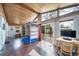 Unique bonus room with climbing wall, wood ceiling, and access to patio at 6625 S Ogden St, Centennial, CO 80121