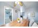 Bright dining room features a wooden table and ceiling fan at 6625 S Ogden St, Centennial, CO 80121