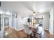 Bright dining room features a wooden table and bench seating with hardwood floors at 6625 S Ogden St, Centennial, CO 80121