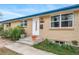 Close up on a ranch house, showing a well-maintained front porch with flower pots at 6625 S Ogden St, Centennial, CO 80121