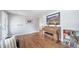 A well-designed living room offers hardwood floors, a piano and natural light at 6625 S Ogden St, Centennial, CO 80121