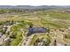 Beautiful aerial view of the neighborhood pond, walking paths, and surrounding homes at 3298 W 11Th Avenue Pl, Broomfield, CO 80020
