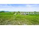 Scenic aerial view of the greenbelt and pond at 3298 W 11Th Avenue Pl, Broomfield, CO 80020