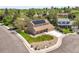 Aerial view of a home with solar panels, surrounded by mature trees and neighborhood at 3298 W 11Th Avenue Pl, Broomfield, CO 80020