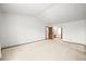 Large bedroom with wall to wall carpet and closet, doorway to bath, and large window at 3298 W 11Th Avenue Pl, Broomfield, CO 80020