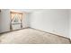 A bright room with a window providing natural light and neutral-colored carpeting at 3298 W 11Th Avenue Pl, Broomfield, CO 80020