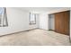 A room with a window dressed with checkered curtains and a closet for storage at 3298 W 11Th Avenue Pl, Broomfield, CO 80020