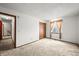 Neutral-carpeted room with natural light from the window, a closet, and hallway access at 3298 W 11Th Avenue Pl, Broomfield, CO 80020