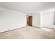 Spacious room featuring neutral carpet and two doorways, perfect for flexible living at 3298 W 11Th Avenue Pl, Broomfield, CO 80020